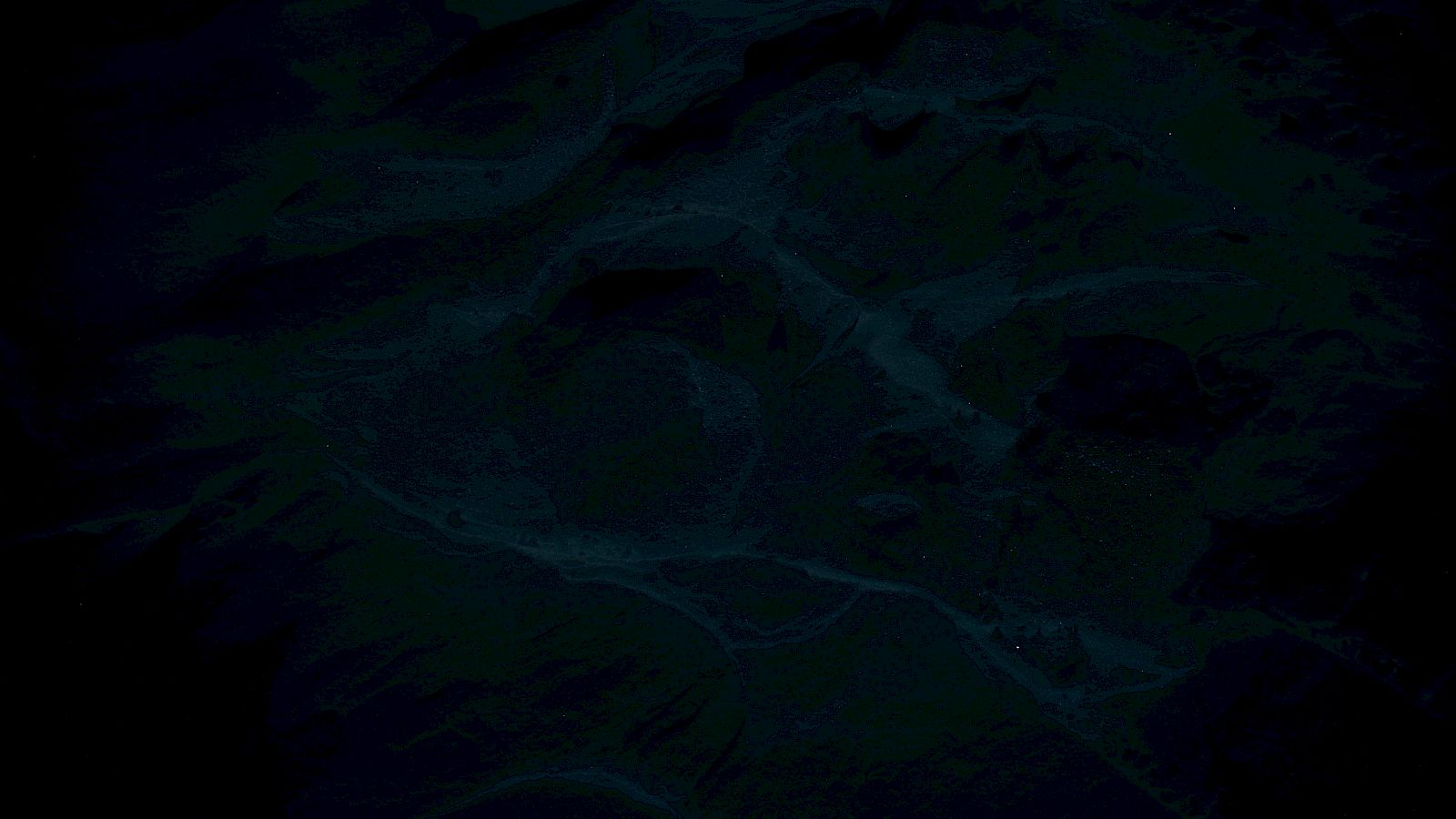 The image is too dark, making it difficult to identify any specific objects or scenes clearly.